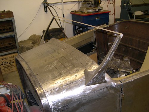  Completely new cowl fabricated using shot bag and mallet, english wheel, shrinker and stretcher. Notice the reverse compound curves. 