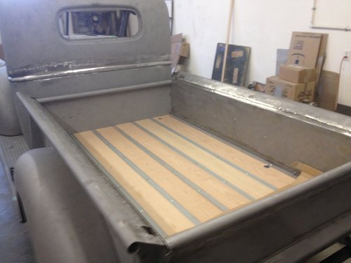   Assembly of restored panels includes installation of new bed wood.  