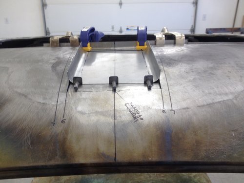 Positioning lower scoop section for welding